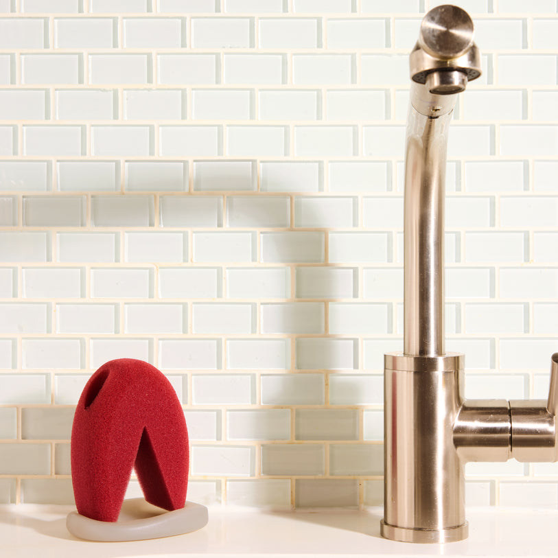 hand washing wine glasses with sponge